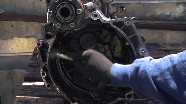manual transmission from an old front-wheel drive car removed for cleaning and washing, repair and replacement of oil seals