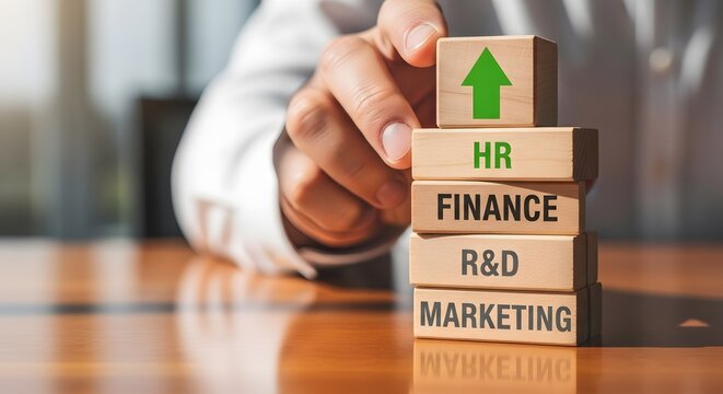 Hand stacking wooden blocks with business departments and green upward arrow