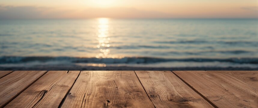 Calm sea and wooden table scene at dusk including ample blank space for graphics