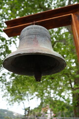 Fototapeta premium Historic Bell Hanging in Wooden Frame in Madeira Forest