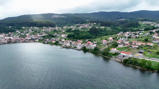 Aerial view flying over the coastal town of combarro in spain