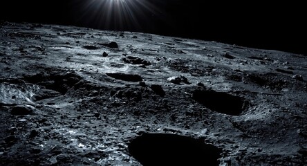 Obraz premium Bright sunlight illuminating the rough lunar surface in orbit