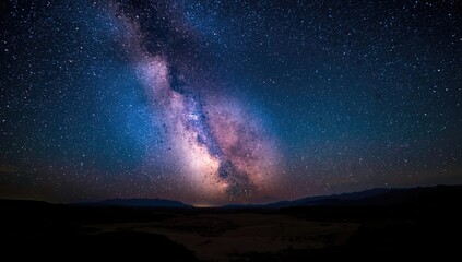 Obraz premium Breathtaking Milky Way spectacle lighting up the arid valley sky