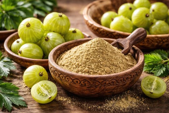 Wholesome diet ingredients featuring fresh gooseberries and amla powder in a carved wooden bowl