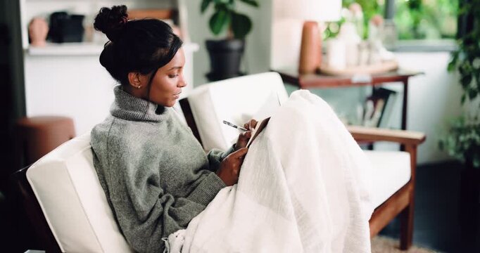Notebook, writing and woman in home on sofa for journalling, reflection and ideas in morning. Happy, thinking and person on couch with journal for diary entry, inspiration and planning in living room