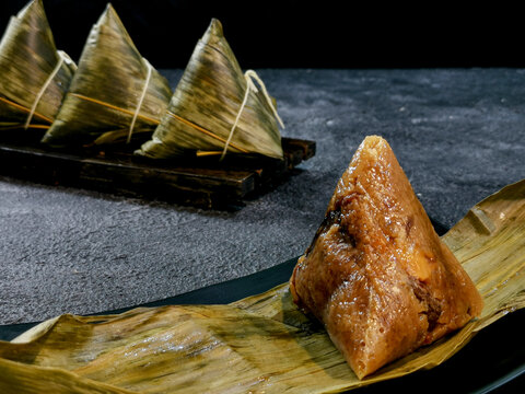 Bacang is a traditional Chinese food that is usually filled with soy sauce pork or chicken, salted egg, and sometimes mushrooms or peanuts.