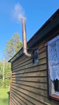 Chimmey at work in a typical russian dacha in the countryside