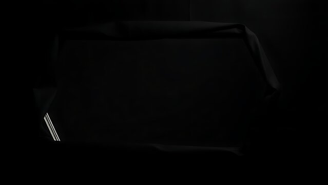 A mirror completely covered and bound with black cloth, no reflection.