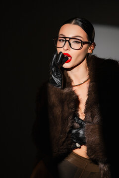Confident Female Representing Corporate Power Through Luxurious Attire And Striking Accessories