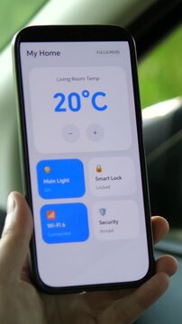 Smart climate control on the go. Sequence shows user increasing room temperature from 18 to 20 degrees via mobile dashboard. Essential footage for green energy, proptech, and modern residential