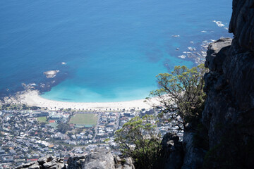 Breathtaking high-angle view of Camps Bay beach, Cape Town, taken from the heights of Table Mountain. © JaenTheLegend