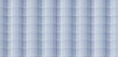 Vertical light blue fluted ceramic tiles providing a clean and modern ribbed texture for...