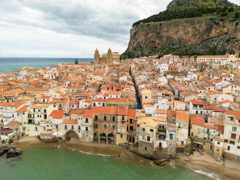 Aerial view of Cefalu town with a gathering storm in the background. Cefal&ugrave; is a coastal town in northern Sicily, Italy. Its Duomo, Cefal&ugrave; Cathedral, is a world heritage site