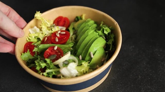 Avocado bowl vegetable salad lunch or dinner tasty snack organic fresh and gourmet food background on the table, rustic food, top view, copy space keto and paleo diets vegetarian and vegan food