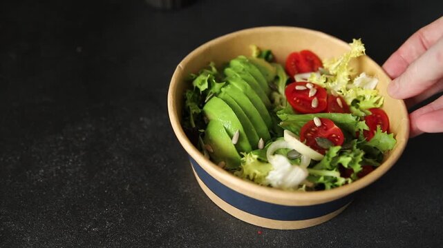 Avocado bowl vegetable salad lunch or dinner tasty snack organic fresh and gourmet food background on the table, rustic food, top view, copy space keto and paleo diets vegetarian and vegan food