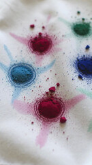 Fototapeta premium Colorful powdered pigments in various shades arranged on fabric surface, showcasing vibrant hues and textures in a creative artistic display