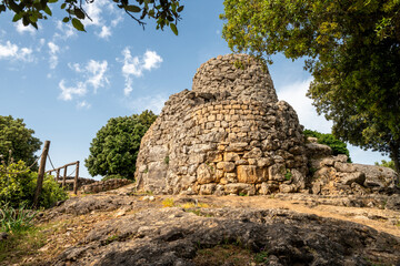 Fototapeta premium Ancient Nuraghe Adoni archaeological site, prehistoric megalithic stone tower of Nuragic civilization, Sardinia, Italy