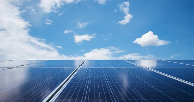 Solar cells panel on rooftop with blue and cloudy sky, Green energy and world sustainable concept.