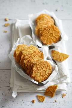 Traditional Dutch butter cookies with embossed patterns served in paper trays