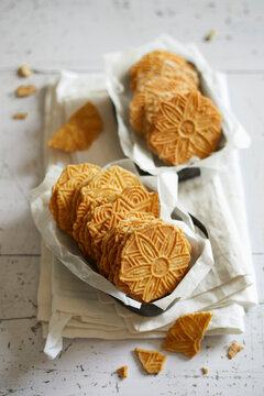 Traditional Dutch butter cookies with embossed patterns served in paper trays