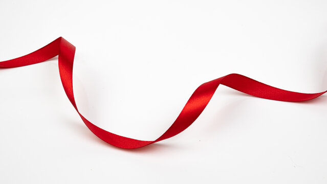 Abstract shape color red ribbon isolated on white background.  top view