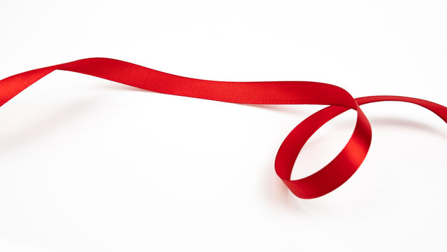 Abstract shape color red ribbon isolated on white background.  top view