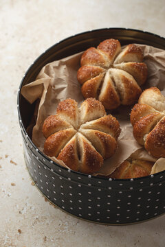 Home baked pumpkin shaped sweet buns in a tin