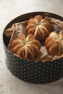 Home baked pumpkin shaped sweet buns in a tin