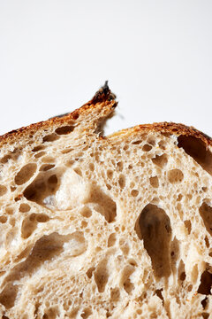Sourdough Loaf Sliced in Half on a Light Background