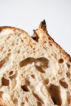 Sourdough Loaf Sliced in Half on a Light Background