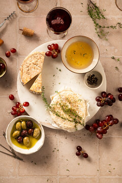 cheese board with red wine glasses