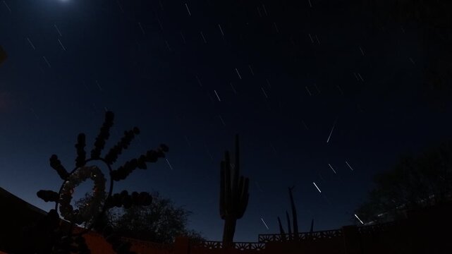 Jet trails, star trails, starburst sculpture, saguaros, moon and International Space Station pass at 9 sec