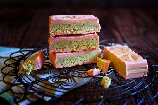 Popular viral trend, pistachio-filled Dubai chocolate bars. Dubai chocolate is a milk chocolate bar filled with a sweet pistachio-tahini cream and kadayif chopped filo pastry.