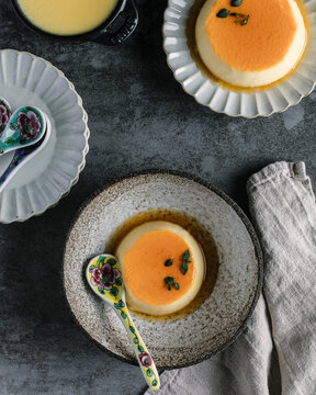 Thyme infused custard served in delicate bowls with aromatic syrup