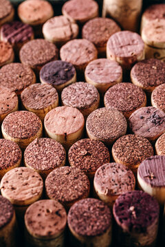 Close-up pattern of textured red wine corks arranged in a tight grid.