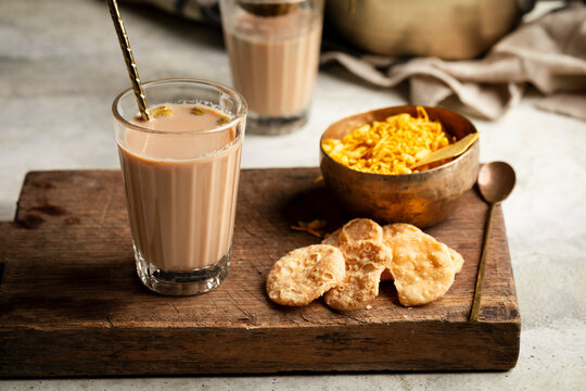 Masala chai with papdi and savory namkeen snacks