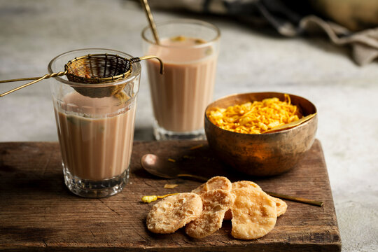 Masala chai with papdi and savory namkeen snacks