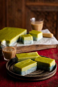 Pandan Custard and blue glutinous rice kueh served with kopi