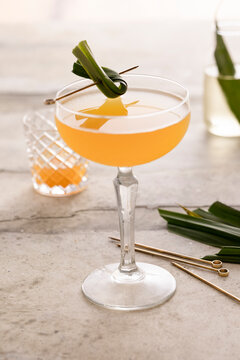 Calamansi lime gimlet with pandan simple syrup and fresh garnish