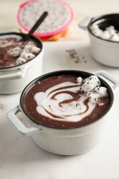 Pulut hitam with coconut swirl topped with fresh dragon fruit cubes