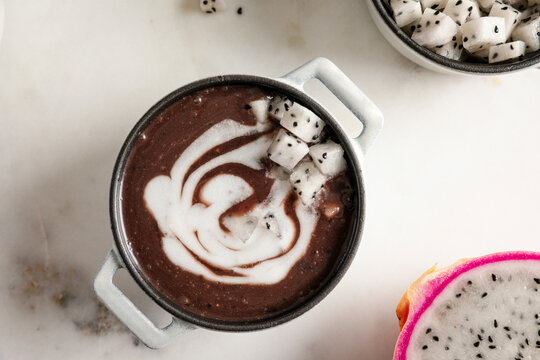 Pulut hitam with coconut swirl topped with fresh dragon fruit cubes