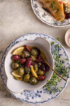 Mixed olives with lemon and thyme in fragrant olive oil marinade