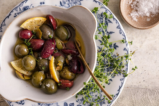 Mixed olives with lemon and thyme in fragrant olive oil marinade