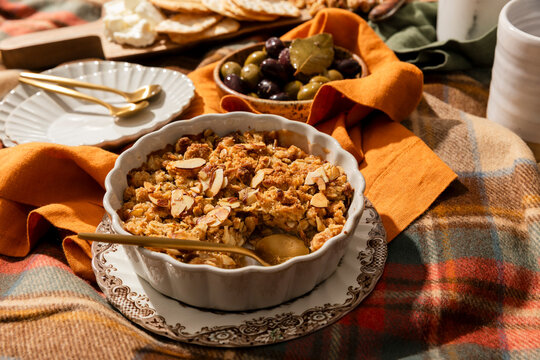 Cozy fall picnic spread with apple crisp and charcuterie