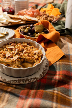 Cozy fall picnic spread with apple crisp and charcuterie