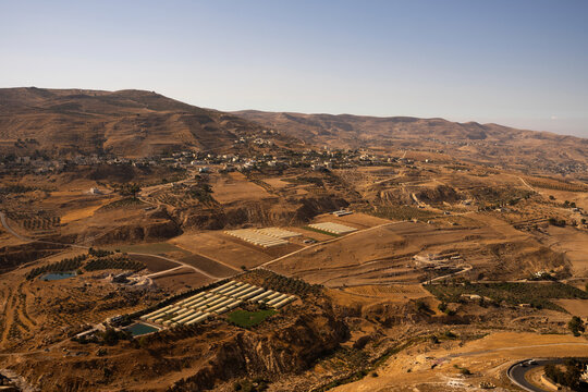 Panoramic view of the arid landscape and agricultural fields from Kerak Castle in Jordan