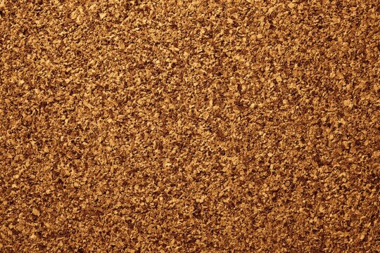 Close-up of a natural corkboard with an empty surface, ideal for creative organization and notes