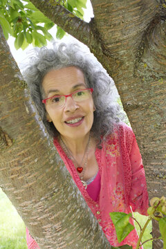 Curious neighbor woman near tree