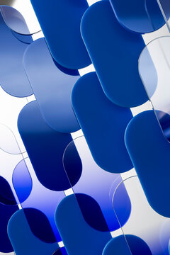 3D blue capsule pattern with layered glass and shadow