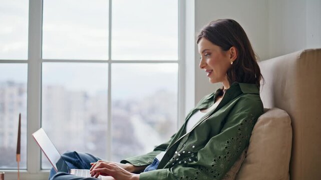 Relaxed writer typing laptop floor feeling inspired closeup. Smiling woman